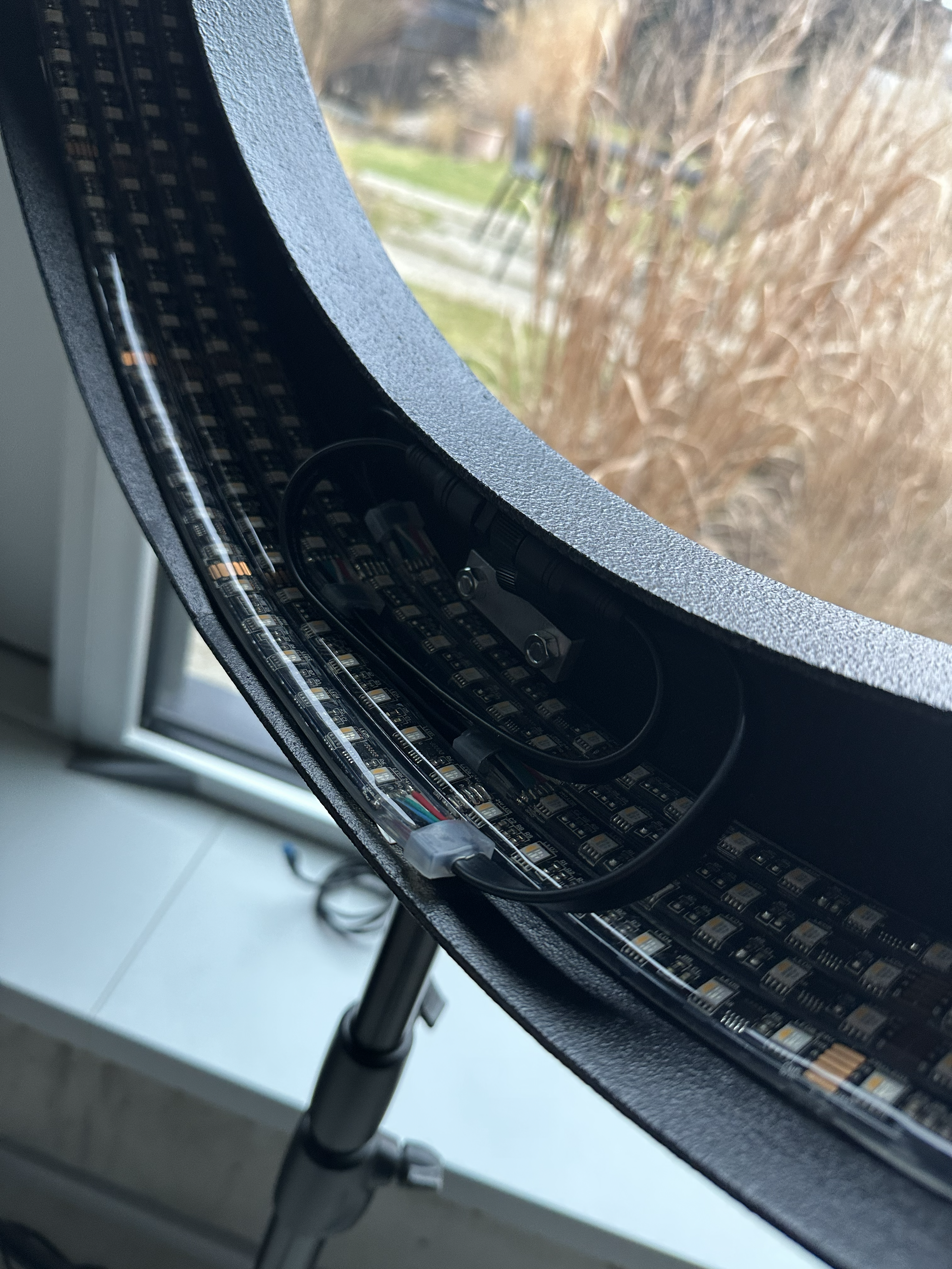 LED strip fitted inside the ring light frame, next to a window