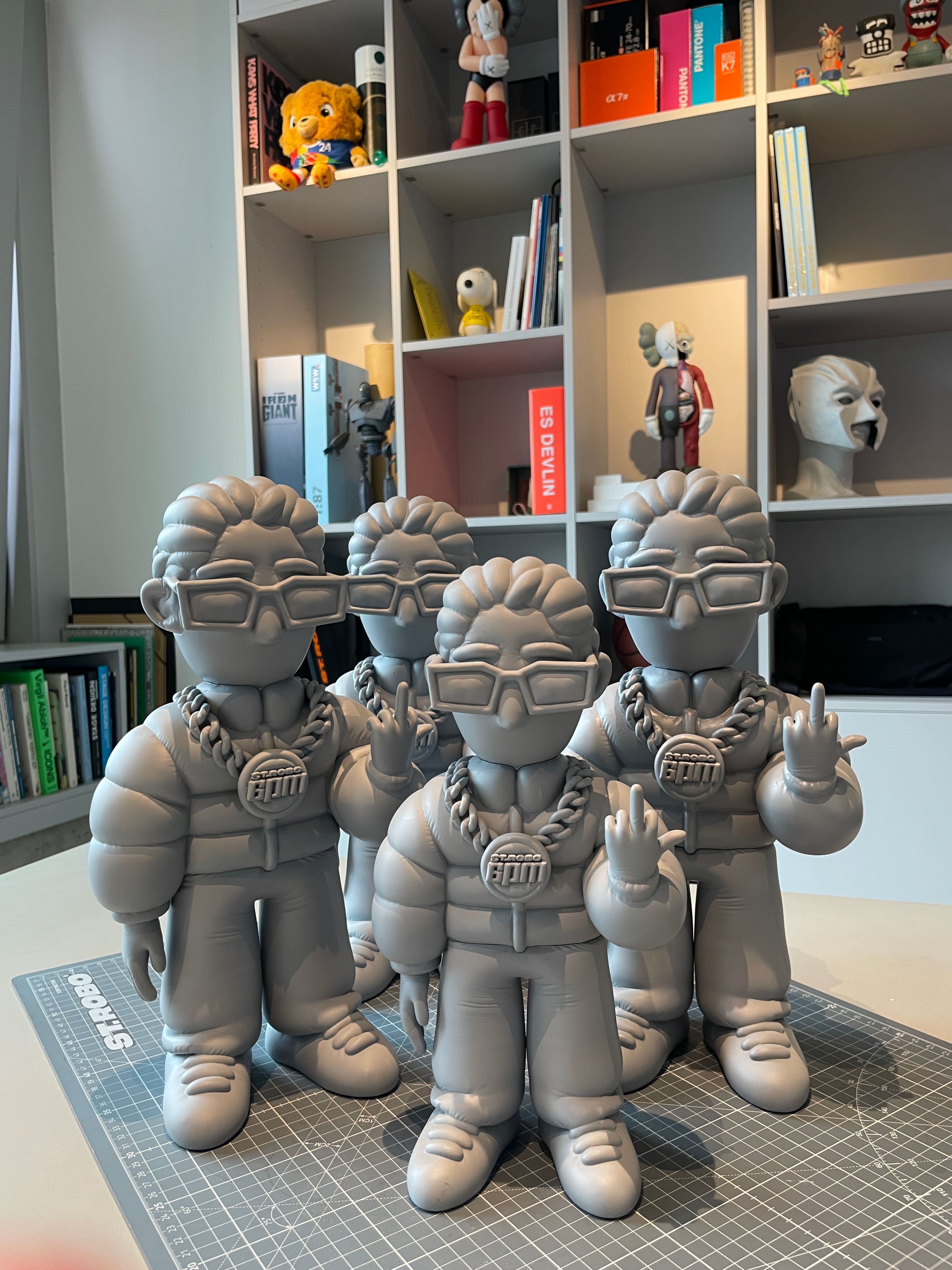 Pink 3D-printed 6PM figures on a pegboard, prototypes for the 6PM Festival inflatables