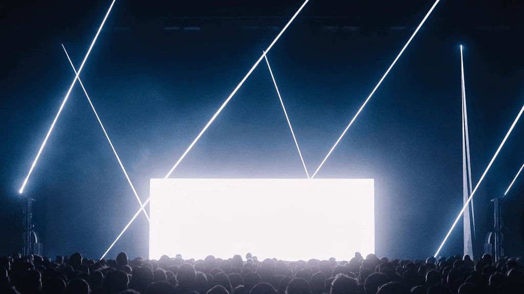 Trettmann tour: light beams framing the white LED wall