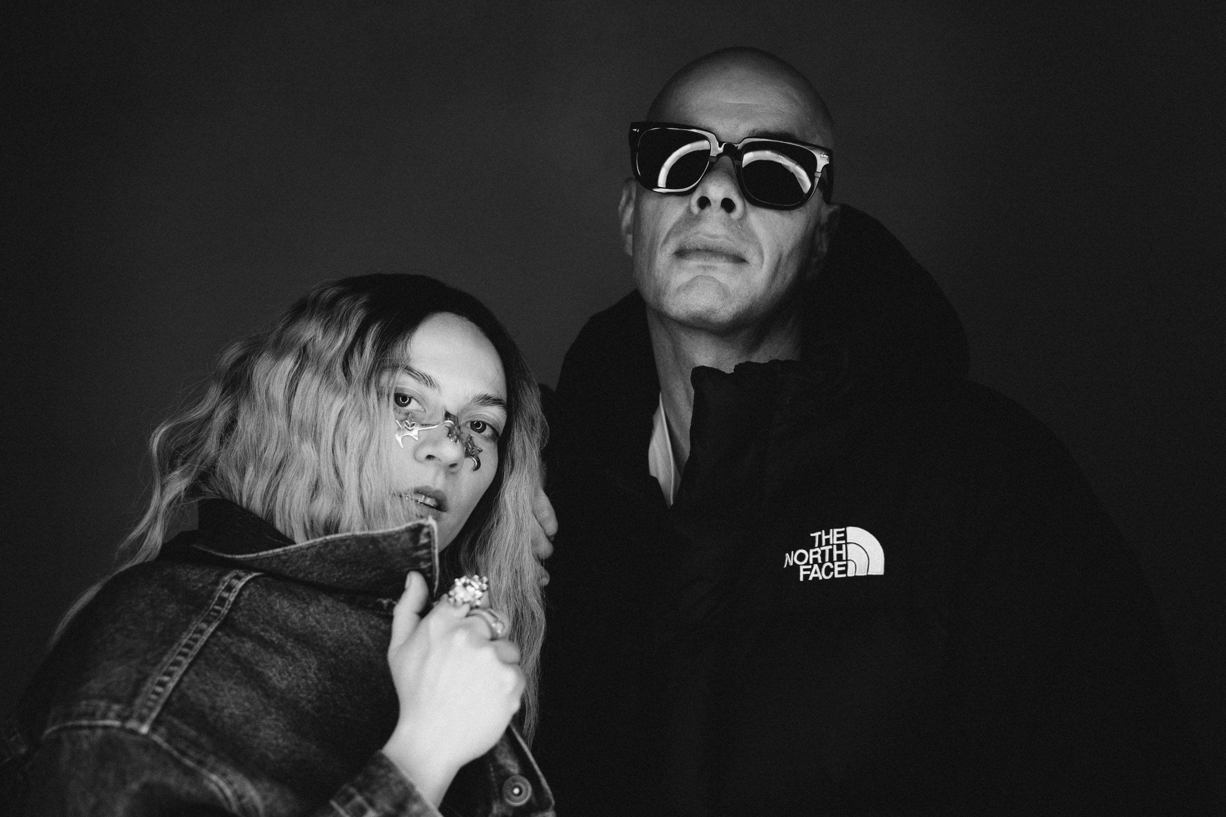 Trettmann and a woman posing in black and white