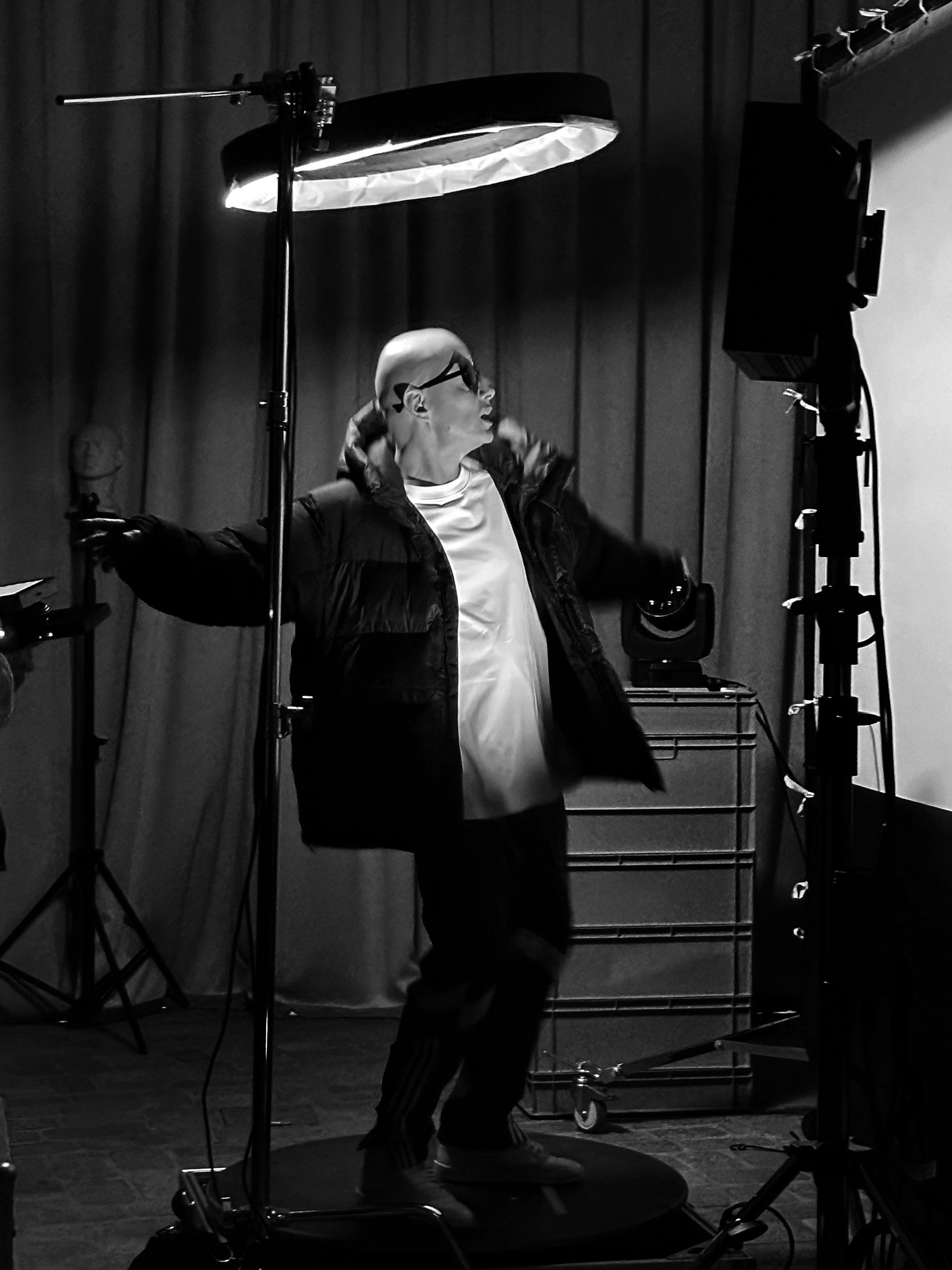 Performer under the ring light on the studio turntable