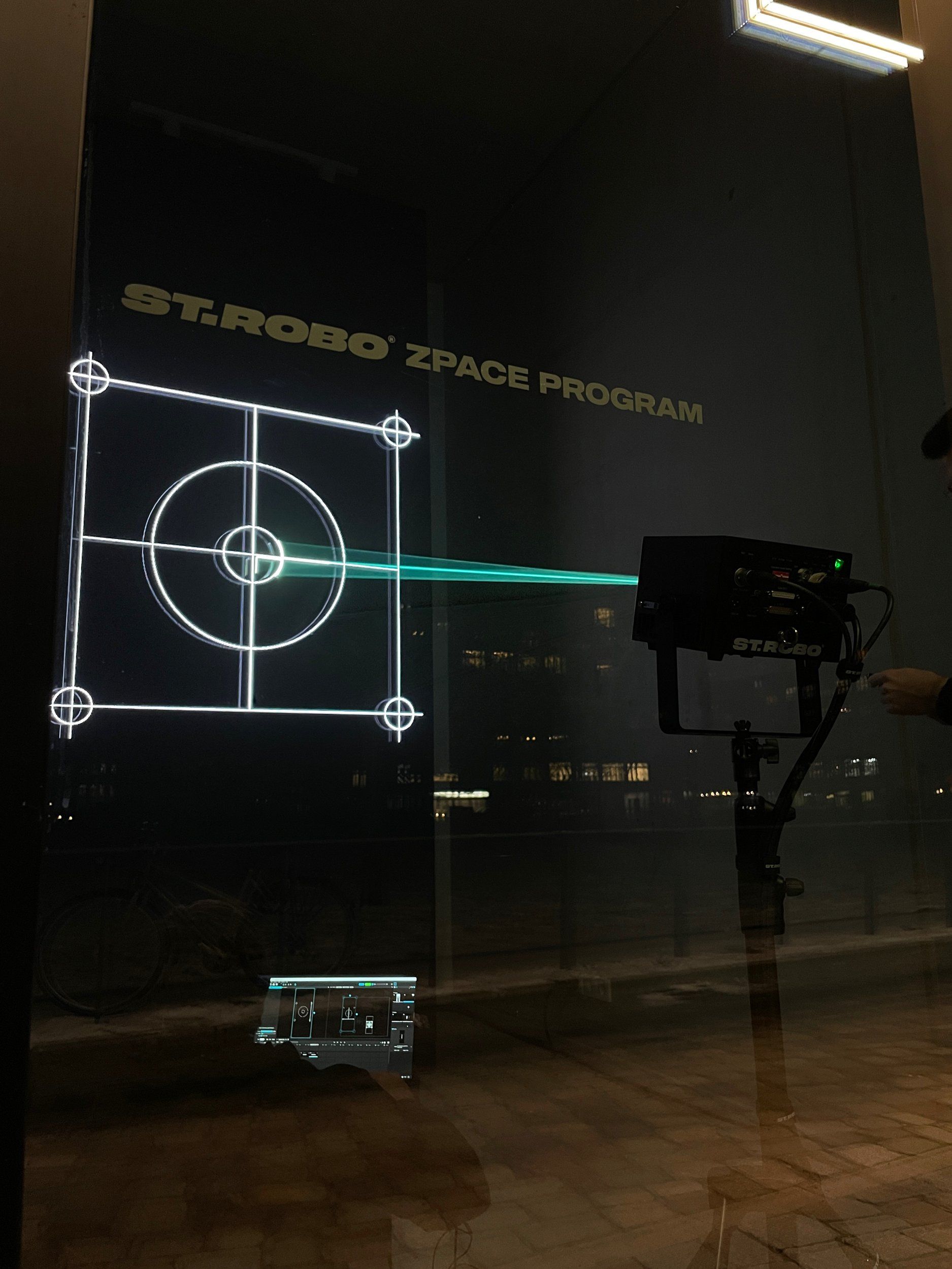 ZPACE LED monolith with laser crosshair in the dark exhibition space